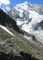 The trail climbs steadily through the flanks of the Besso