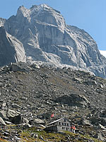 The Capanna Sciora, towered over by one of the walls of Val Bondasca