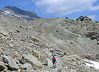 In the barren mineral landscape just below the cabin