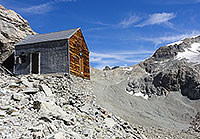 Bivacco Col Collon, with Col Collon in the background